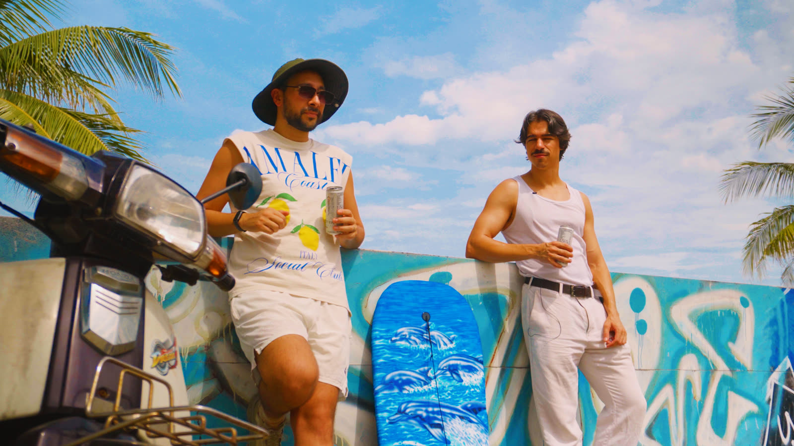The same frame through the Retro Surf LUT: turquoise wall, blue sky with pink clouds, warm skin