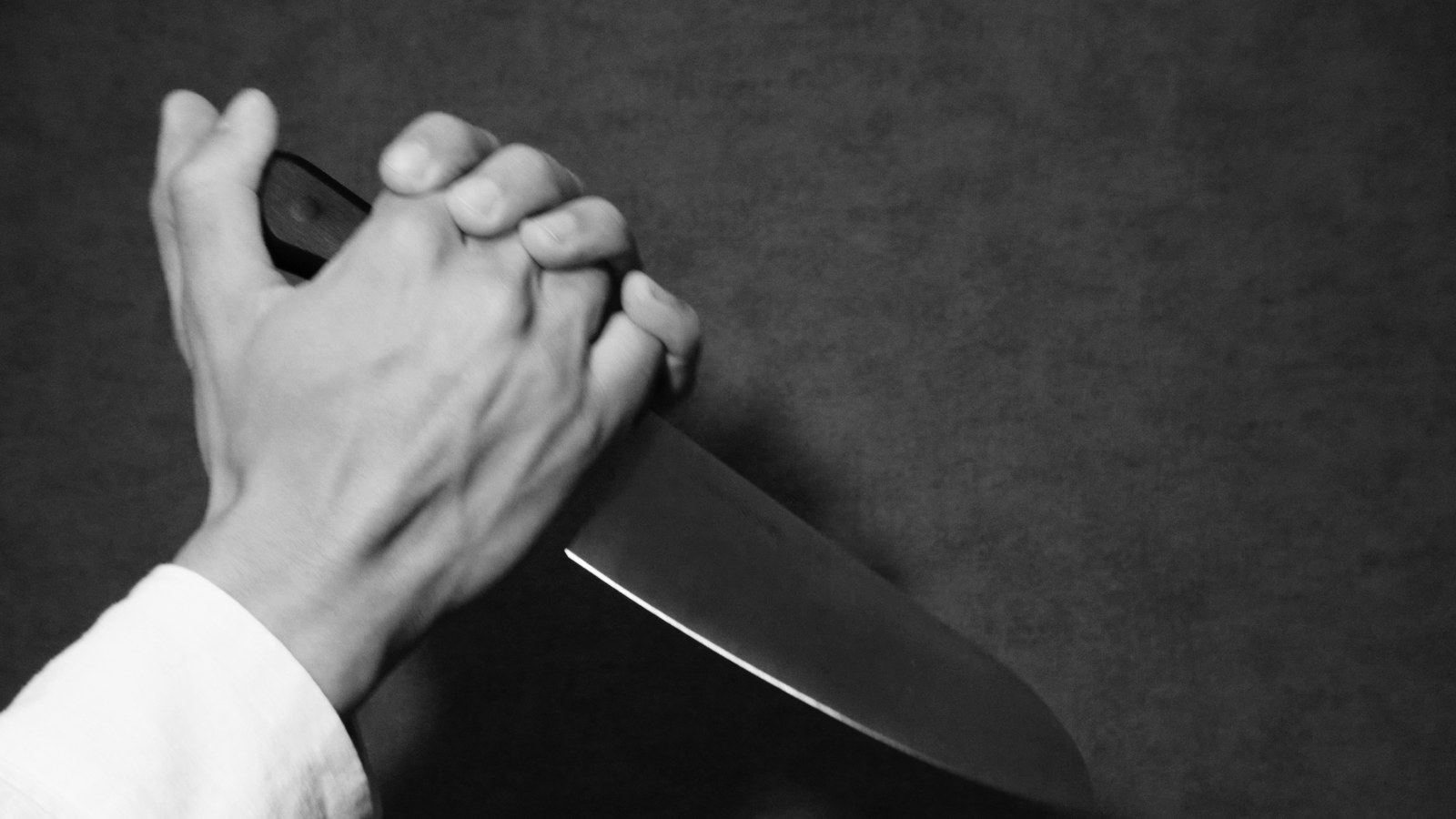 The same frame through the Ronin LUT: deep black background, bright sculpted skin, a bright specular along the blade